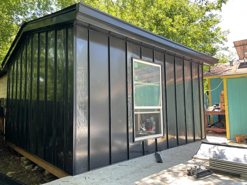 Black standing seam metal wall panels for Metal Roof Installation in Pratt