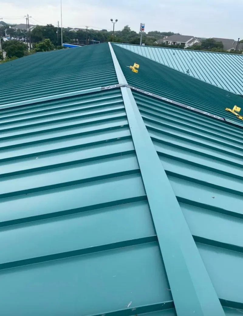 Green commercial metal roof ridge and valley for Metal Roof Repair in Pratt